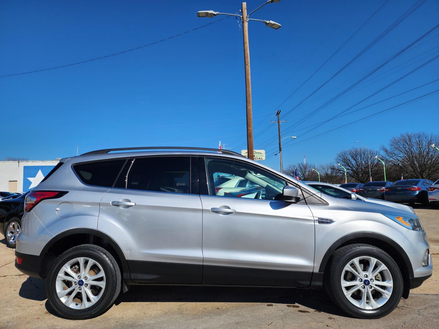 2017 SILVER Ford Escape SE (1FMCU0GD3HU) with an 1.5L L4 DOHC 16V engine, 6A transmission, located at 2660 S.Garland Avenue, Garland, TX, 75041, (469) 298-3118, 32.885551, -96.655602 - Welcome to DallasAutos4Less, one of the Premier BUY HERE PAY HERE Dealers in the North Dallas Area. We specialize in financing to people with NO CREDIT or BAD CREDIT. We need proof of income, proof of residence, and a ID. Come buy your new car from us today!! This is a Super Clean 2017 FORD ESCAP - Photo#2